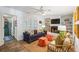 Spacious living room features hardwood floors, a ceiling fan, comfortable seating, and a fireplace with built-in shelving at 705 Williamson Dr # C, Mount Pleasant, SC 29464