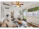 Enclosed sun room provides an additional living space with fan, seating, and natural light at 705 Williamson Dr # C, Mount Pleasant, SC 29464