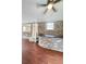 Basement bar area featuring a brick wall and hardwood floors at 710 Gadsden Loop, Walterboro, SC 29488