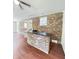 Brick basement wet bar area with hardwood floors and access to multiple rooms at 710 Gadsden Loop, Walterboro, SC 29488