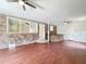 Wide angle view of the basement, brick accent wall with bar, and wood flooring at 710 Gadsden Loop, Walterboro, SC 29488