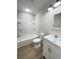Bright bathroom with a white vanity, toilet, and a shower-tub combo with white tile surround at 710 Gadsden Loop, Walterboro, SC 29488