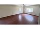 Spacious bedroom featuring hardwood floors, bright natural light, and neutral paint at 710 Gadsden Loop, Walterboro, SC 29488