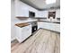 Bright kitchen with white cabinets, stainless appliances, and butcher block countertops at 710 Gadsden Loop, Walterboro, SC 29488