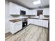 This kitchen features white cabinets, stainless appliances, and butcher block countertops at 710 Gadsden Loop, Walterboro, SC 29488