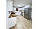 Bright kitchen with stainless appliances, white cabinets, and butcher block countertops at 710 Gadsden Loop, Walterboro, SC 29488