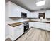 Bright kitchen with white cabinets, stainless appliances, and butcher block countertops at 710 Gadsden Loop, Walterboro, SC 29488