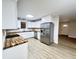 Bright kitchen with stainless appliances, white cabinets, and butcher block countertops at 710 Gadsden Loop, Walterboro, SC 29488