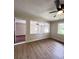 Bright living room featuring vinyl wood floors, a ceiling fan, and a decorative partition at 710 Gadsden Loop, Walterboro, SC 29488