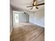 Spacious living room featuring ceiling fans, wood-look flooring, and neutral paint at 710 Gadsden Loop, Walterboro, SC 29488