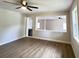 Bright and spacious living room with hardwood floors and a modern ceiling fan at 710 Gadsden Loop, Walterboro, SC 29488