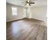 Modern living room with stylish hardwood floors, fresh paint, and ceiling fan at 710 Gadsden Loop, Walterboro, SC 29488