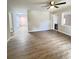 Open concept living room featuring stylish hardwood floors and plenty of natural light at 710 Gadsden Loop, Walterboro, SC 29488
