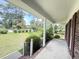 Relaxing front porch with view of expansive front yard and neighborhood at 710 Gadsden Loop, Walterboro, SC 29488