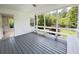 Spacious screened porch offering a serene space with neutral paint, great natural light and a built-in bench at 710 Gadsden Loop, Walterboro, SC 29488