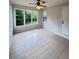Sunroom with tile flooring, ceiling fan, natural light and views of backyard at 710 Gadsden Loop, Walterboro, SC 29488