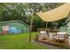 Backyard featuring a covered deck and a mural-covered building at 716 White Oak Dr, Charleston, SC 29407