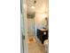 Bathroom with a tiled shower, dark vanity, granite counter, and neutral paint at 716 White Oak Dr, Charleston, SC 29407