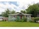 Charming home with a well-manicured front yard, beautiful landscaping, and shuttered windows at 716 White Oak Dr, Charleston, SC 29407