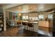 Bright kitchen features granite countertops, an island with seating, and a dining area with natural light at 716 White Oak Dr, Charleston, SC 29407