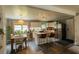Bright open kitchen featuring an island with seating, stainless steel appliances, and a dining area at 716 White Oak Dr, Charleston, SC 29407