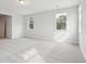 A bright bedroom with two windows offering lots of natural light and neutral carpet at 735 Breakers Reef Ln, Huger, SC 29450