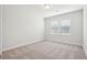Cozy bedroom featuring carpet flooring, a window with blinds, and neutral paint at 735 Breakers Reef Ln, Huger, SC 29450