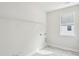 Bright laundry room with a window for natural light and a shelf for organizing supplies at 735 Breakers Reef Ln, Huger, SC 29450