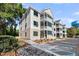 Attractive three-story building with balconies, handicap parking, and well-kept grounds at 7413 Indigo Palms Way, Johns Island, SC 29455