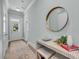 Welcoming entryway with stylish console table, mirror, and decorative accents at 7413 Indigo Palms Way, Johns Island, SC 29455
