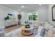 Stylish living room featuring hardwood floors, comfortable seating, and natural light at 7413 Indigo Palms Way, Johns Island, SC 29455