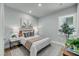 Cozy bedroom featuring neutral decor and a bright window view at 7432 Indigo Palms Way, Johns Island, SC 29455