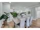 Bright dining room with modern table and chairs, open to the kitchen area at 7432 Indigo Palms Way, Johns Island, SC 29455