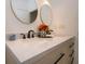 Modern bathroom featuring double sinks, quartz countertops, gold framed mirrors and elegant fixtures at 760 Natchez Circle Cir, Mount Pleasant, SC 29464