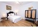 Cozy bedroom featuring a well-made bed, stylish furnishings, and neutral color palette, complemented by wood-look floors at 760 Natchez Circle Cir, Mount Pleasant, SC 29464