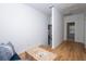 Hallway with hardwood floors leading to a room with natural light and neutral color scheme at 760 Natchez Circle Cir, Mount Pleasant, SC 29464