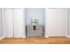 Hallway displaying decorative table between bi-fold closet doors, adding a touch of elegance to the space at 760 Natchez Circle Cir, Mount Pleasant, SC 29464