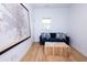 Bright living room with comfortable blue sofa, hardwood floors, and decorative wall art at 760 Natchez Circle Cir, Mount Pleasant, SC 29464