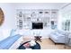 Living room featuring hardwood floors, custom built-ins, natural light, and comfortable seating at 760 Natchez Circle Cir, Mount Pleasant, SC 29464
