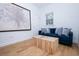 Well-lit living room with a comfortable blue sofa, unique coffee table, and hardwood floors at 760 Natchez Circle Cir, Mount Pleasant, SC 29464