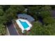 Community pool surrounded by verdant trees, with a charming pavilion at 760 Natchez Circle Cir, Mount Pleasant, SC 29464