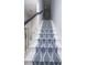 Elegant staircase with white banister and a striking patterned runner at 760 Natchez Circle Cir, Mount Pleasant, SC 29464