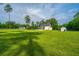 Beautiful home with a sprawling backyard, pool, storage shed, and lush green grass at 810 Highway 61, Ridgeville, SC 29472
