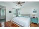 Charming bedroom features a king-sized bed, ceiling fan, and two windows providing natural light at 810 Highway 61, Ridgeville, SC 29472