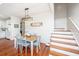 Inviting dining area featuring wood floors, table with seating for six, and stylish light fixture at 810 Highway 61, Ridgeville, SC 29472