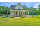 Charming two-story home featuring a spacious porch and an above-ground pool at 810 Highway 61, Ridgeville, SC 29472