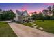 Beautiful two-story home with a large front yard and a charming porch at 810 Highway 61, Ridgeville, SC 29472