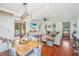 Open-concept living space with wood floors and access to an outdoor pool at 810 Highway 61, Ridgeville, SC 29472