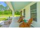 Cozy front porch with rocking chairs, offering a relaxing outdoor space at 810 Highway 61, Ridgeville, SC 29472