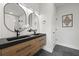 Modern bathroom features a double vanity, stylish mirrors, and sleek fixtures at 868 Tripe St, Charleston, SC 29407